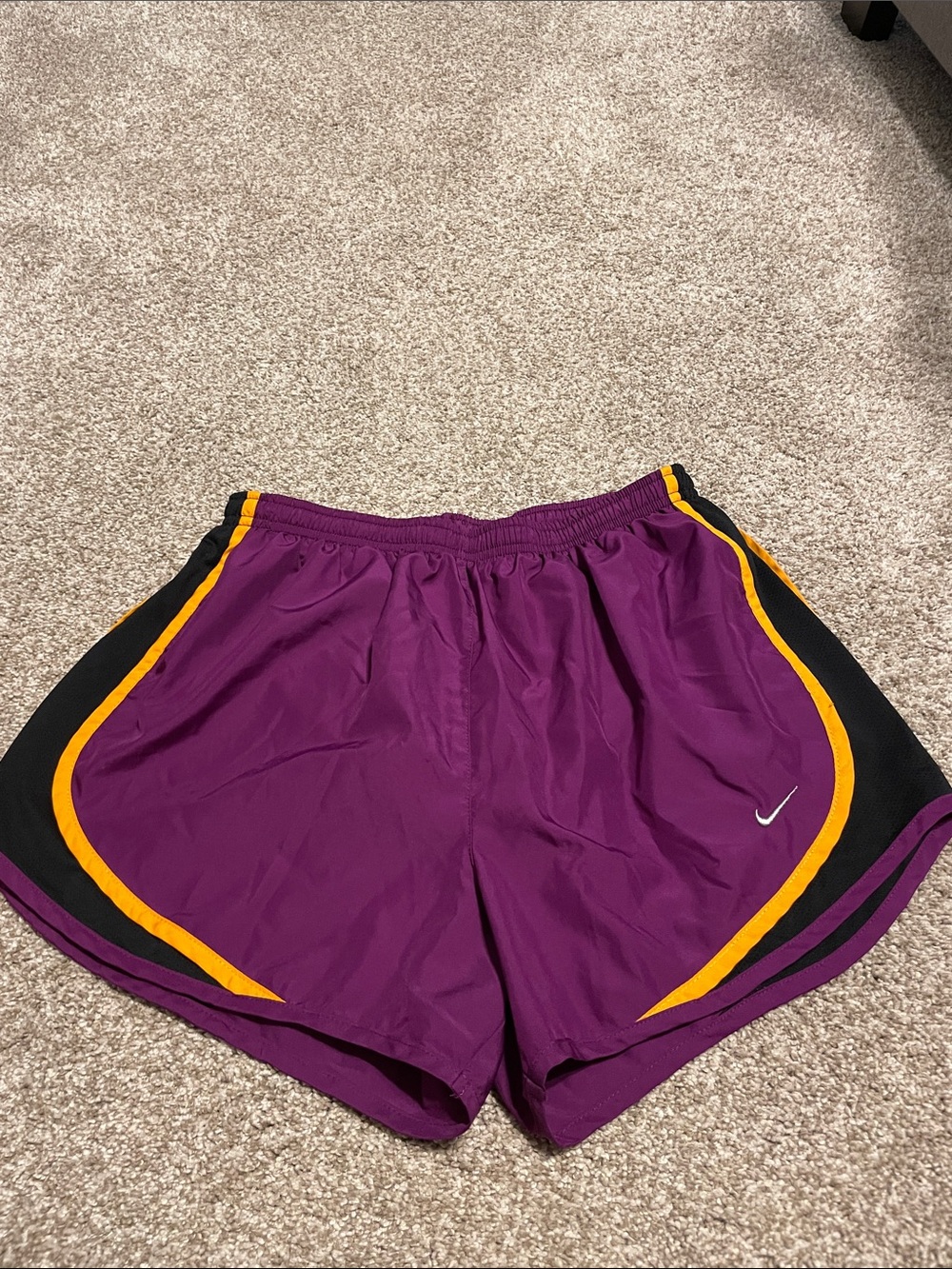 Nike Women’s Purple Athletic Shorts with bright Orange Trim and Black Panels